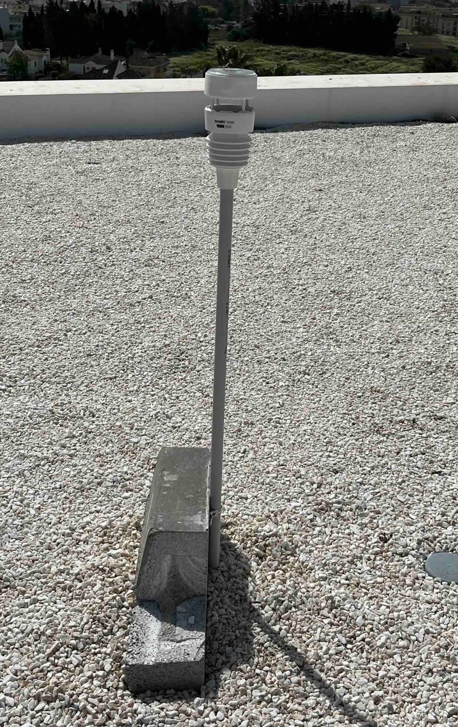 The WS-90 weather station mounted on a mast on the roof
